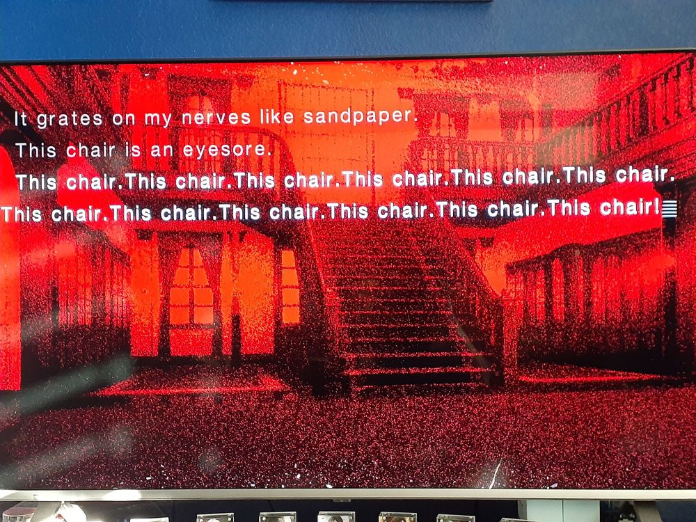 Still image of a moment in Tsukihime. The famous "THIS CHAIR" moment.