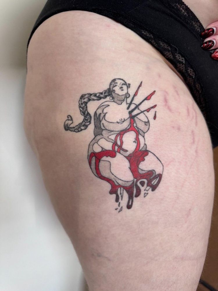 Healed tattoo of a fat woman with three spikes through her chest and blood dripping down over her stomach and thighs. She has a long braid that flows behind her. The red blood is very vibrant and the rest of the shading and linework has softened and set into the skin evenly. 