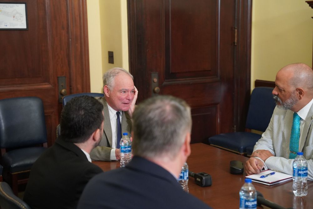Senator Kaine speaks with the State Department officers during their meeting. 