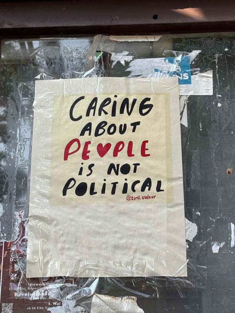 En affisch där det står Caring about people is not political. 
