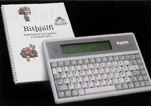 A flat machine that's just a colour coded keyboard and a segmented display with a book.