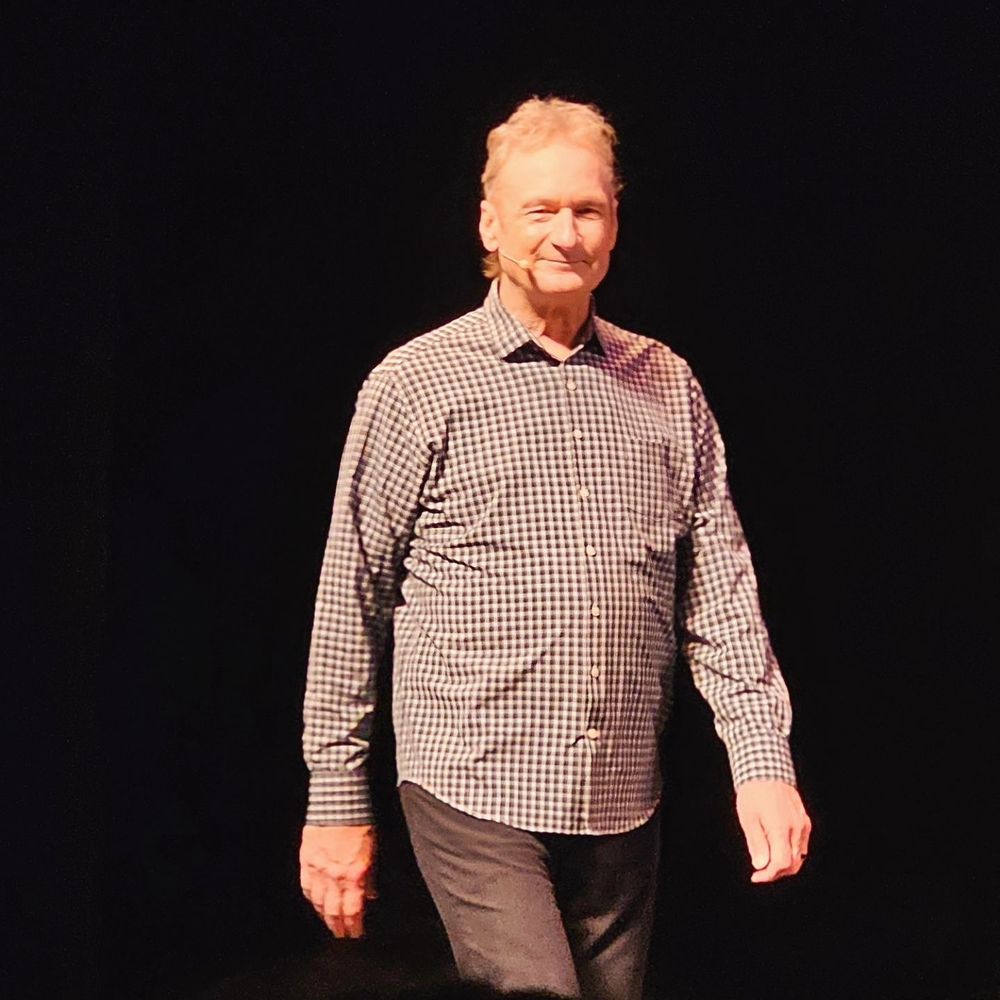Ryan Stiles, on stage, looking cute in front of a black background. Did I mention he's looking cute? Because he is. 