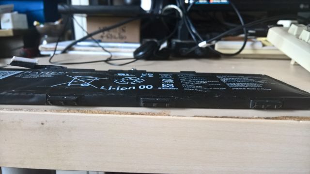 A severely bulging laptop battery.