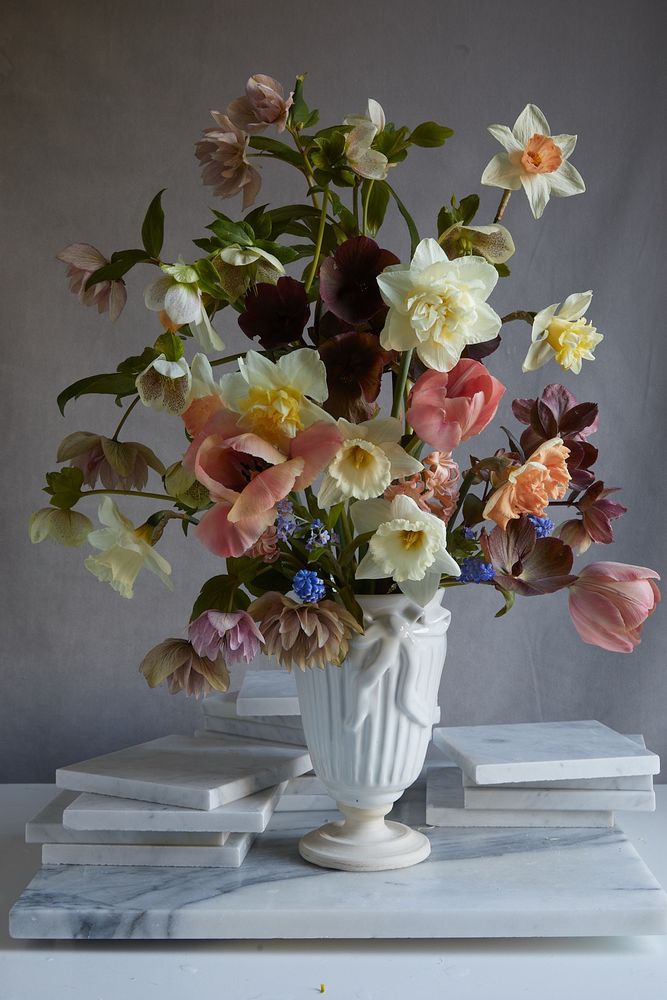 Spring flowers in a classic white vase. 