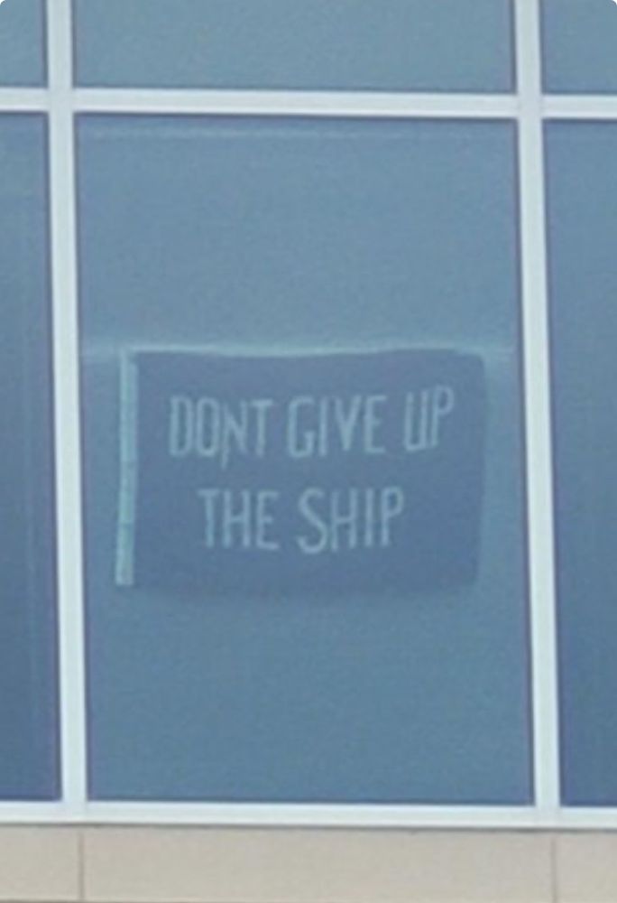Don’t give up the ship flag hanging in an fda building 