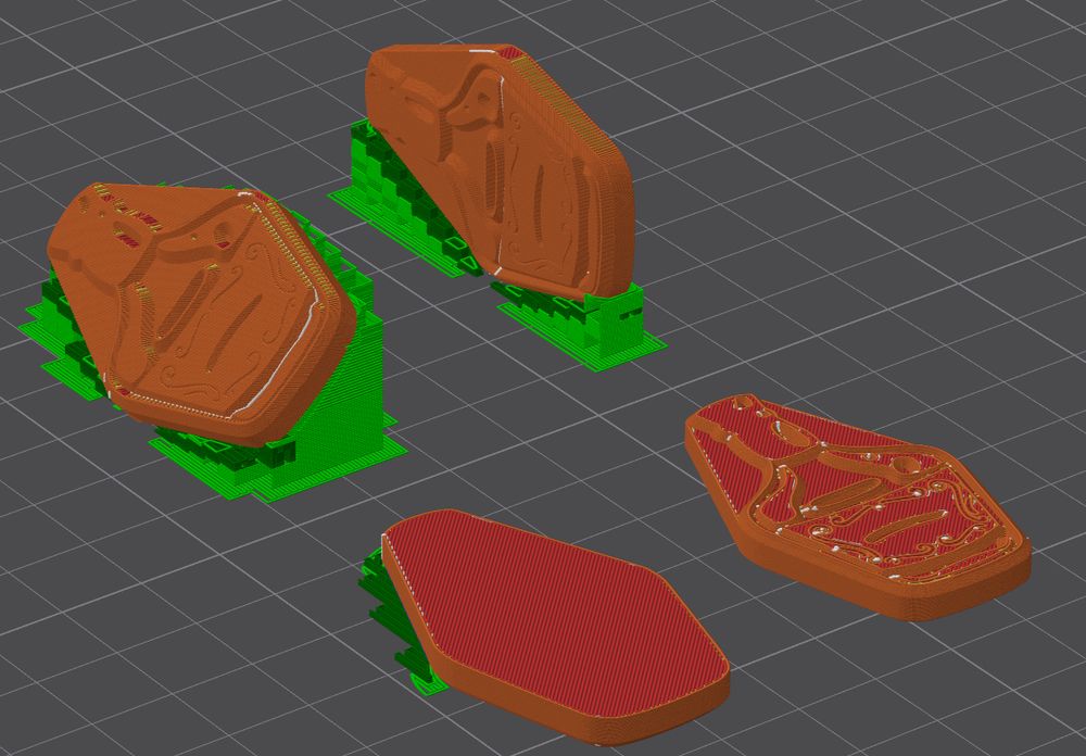 The stamps themselves in a slicer program to prepare them for 3d printing. One is positioned image side down, one image side up, one is printed vertically, and another is printed at 45 degrees from vertical, with the image on the "up side".