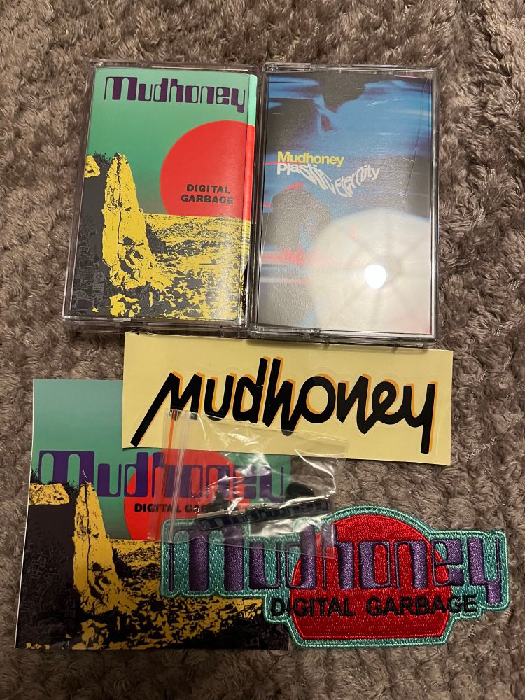 Cassettes of the last two Mudhoney albums, plus Mudhoney badge, patch and stickers!