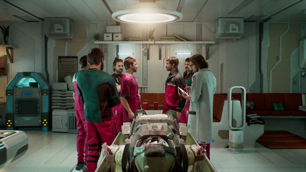 several men in pink/teal suits discussing something