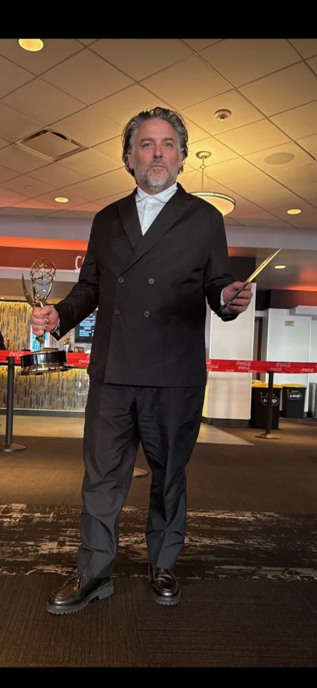 Photo of Jeremy holding his Emmy Award