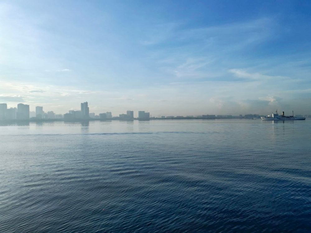 Manila skyline and ship captured from Manila Bay early morning in 2018.