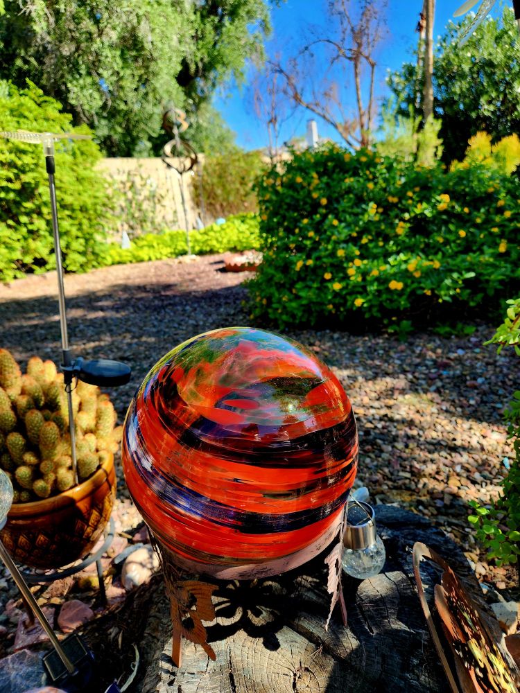 every time I sit here, in front of a decorative ornamental glass ball, a ladyfinger cactus in a brown pot and currently a very deflated looking, but otherwise vibrantly yellow, splattered with colour from its tiny clusters of trumpet shaped flowers, the lantana Bush, I ponder that dead ficus tree in the distance, currently silhouetted against the lone patch of blue