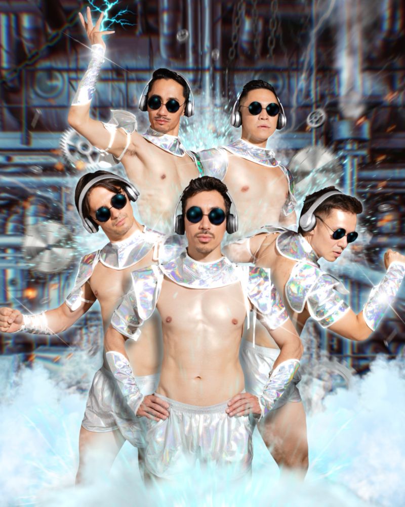 Photo of all the Dragon Boiz, dressed up in skimpy Cyberman inspired outfits, edited in against a factory background, complete with hissing steam and sparks and buzzing machinery.
