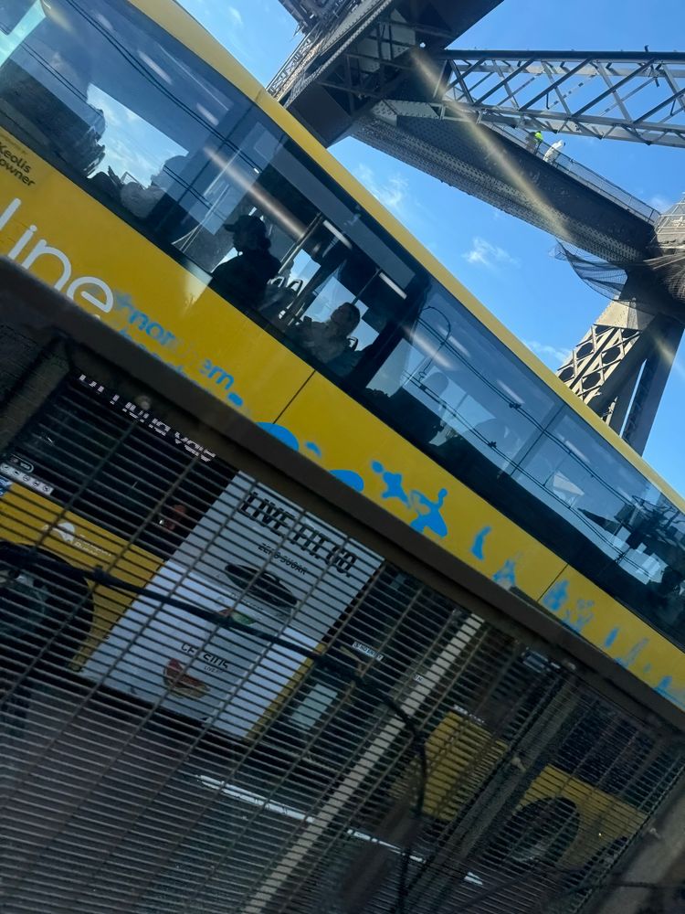 A yellow double decker bus seen diagonally.