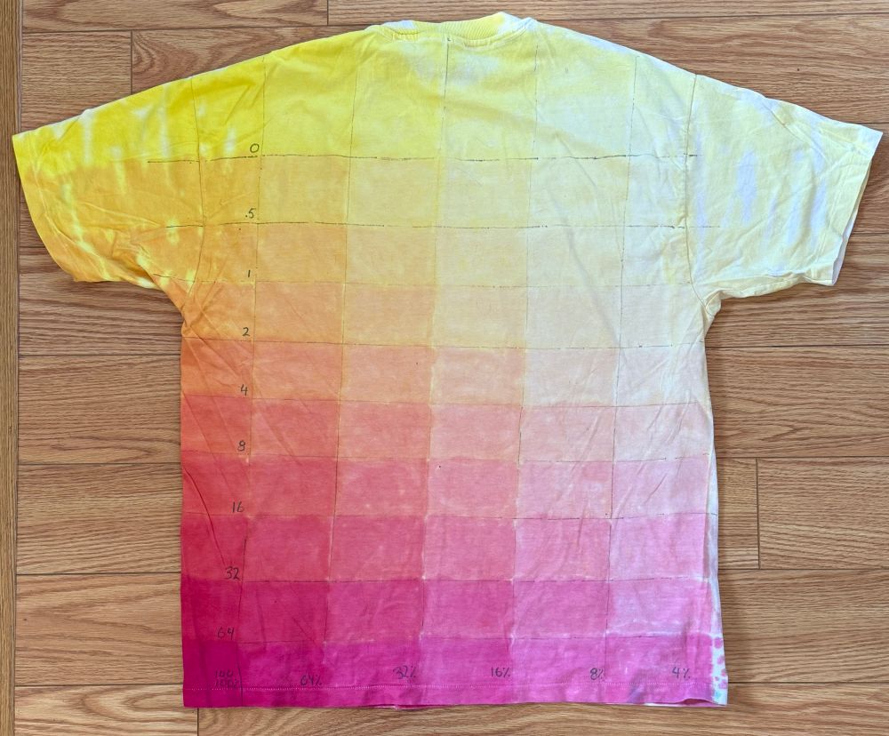 T-shirt with a sample of color tests blending red into yellow and diluting