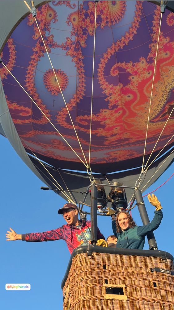 Father and daughter launching in a fractal art hotair balloon. 