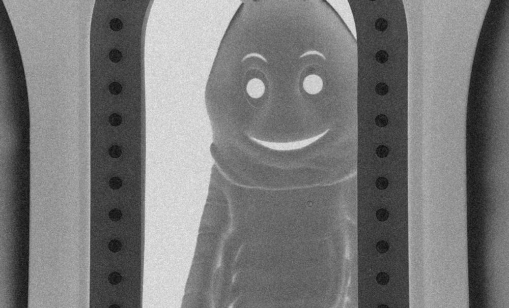 A lobster mascot stands in the threshold of the Game Changer set doorway, but now it's black and white with film grain