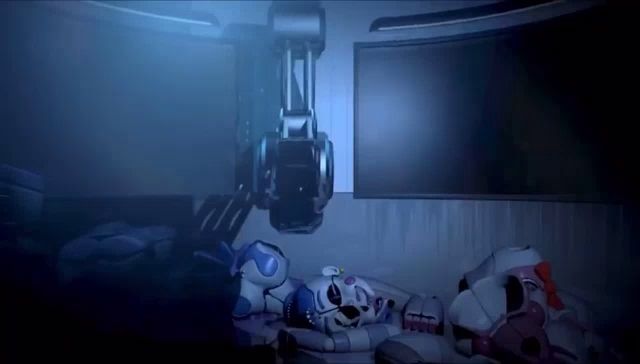 a robot is laying on the floor in a dark room