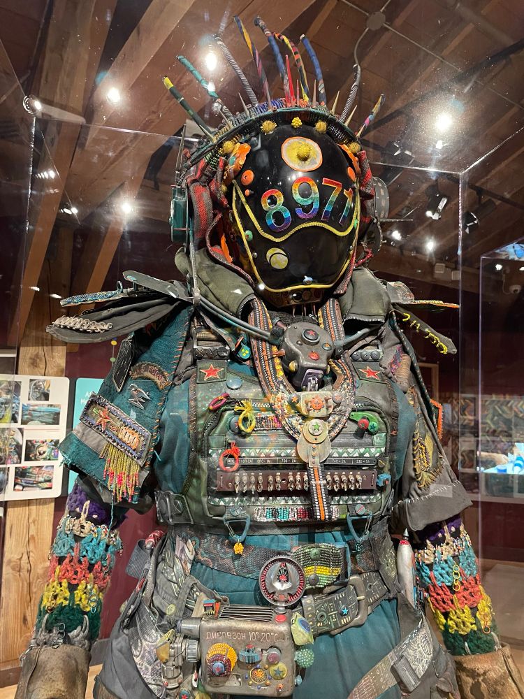 A flight suit reimagined in African beads and random objects as part of The MiG-21 Project.