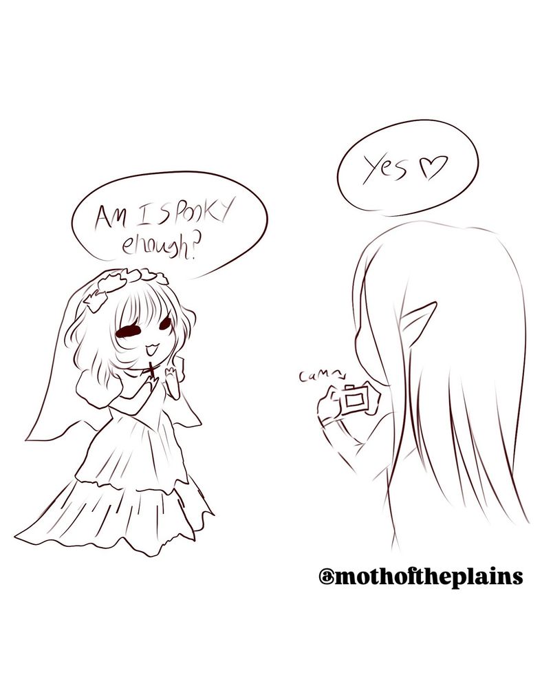 Amy’s husband taking a photo of her in her wedding dress. 