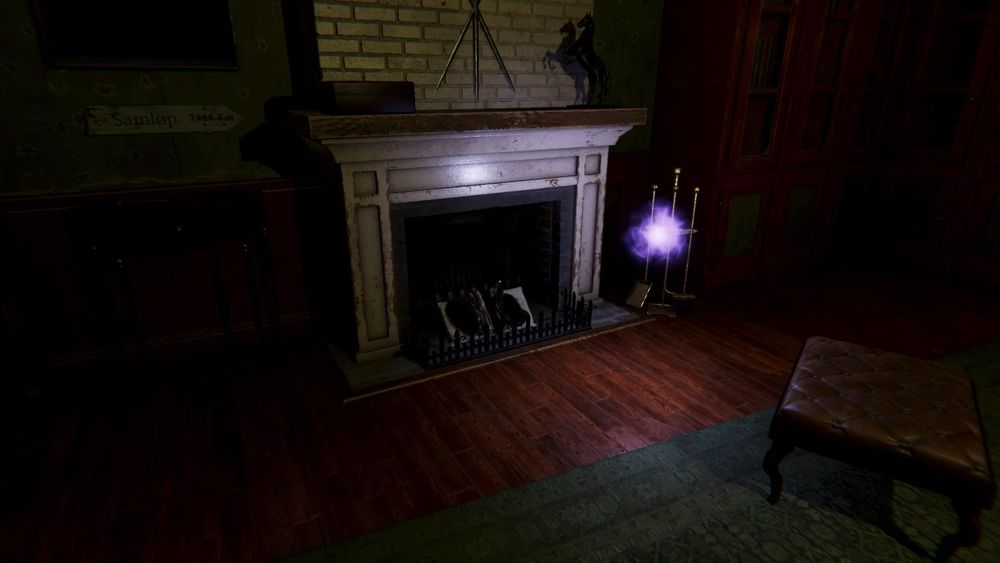 A screenshot from The Haunting of Joni Evers showing a ball of light floating mysteriously in front of a fireplace with a burned book.