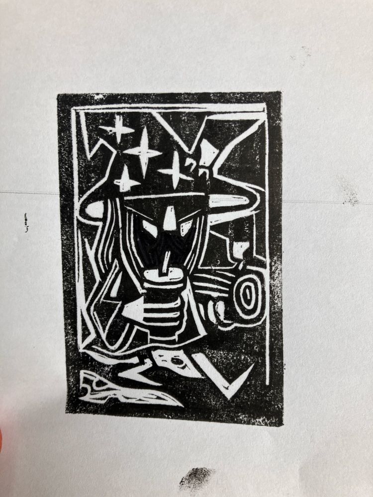Test print of a rubberised lino printing block depicting a wizard walking by 