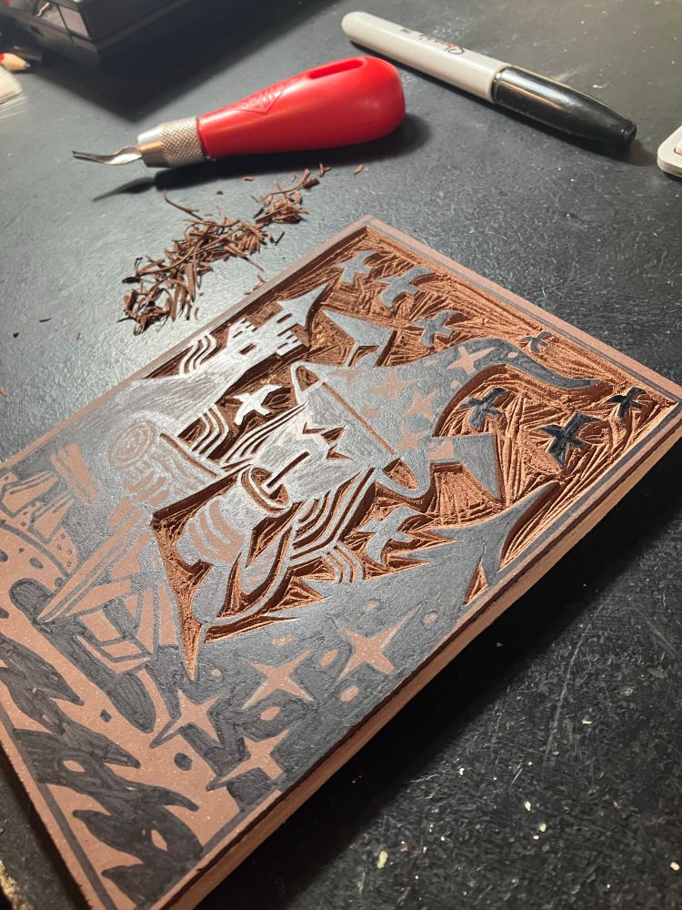Lino block mid carving 
Depicts a wizard holding a log whilst sipping on a drink in a cup with a straw. Birds are flying about and there’s a castle on a mountain along with a megalith 