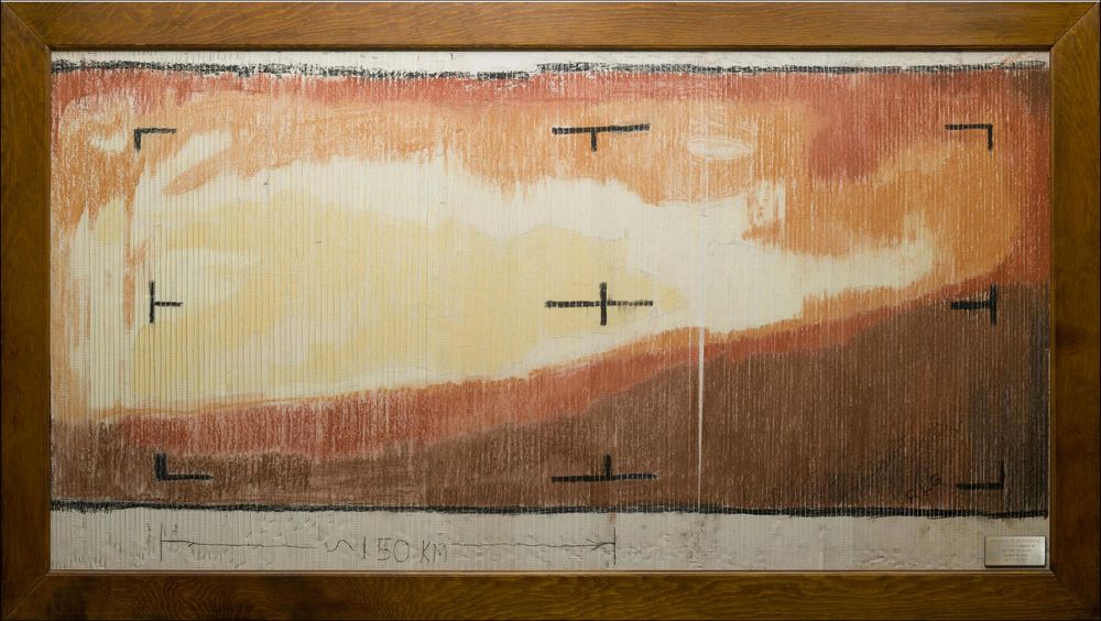 Shades of brown and red colored in on top of strips of paper on a bulletin board. It's a fairly large board, though you can't really tell that from the photo! The lower right is dark and the upper left is brighter.