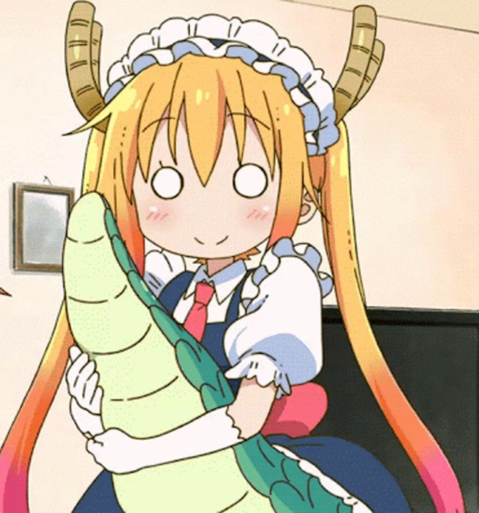 a girl with horns is holding a stuffed animal in her arms