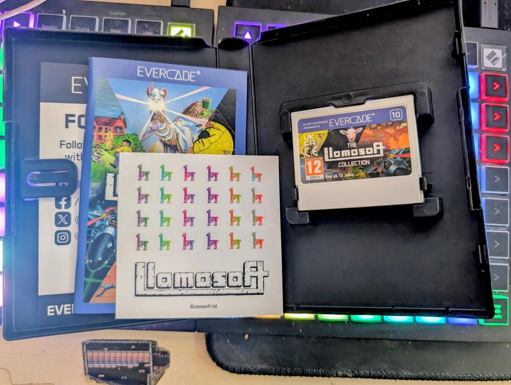 Showing the contents of the Evercade package. I like the llama stickers!