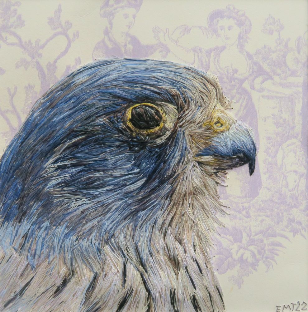 Hand embroidered Kestrel head profile looking to the right on a lilac and white patterned wallpaper 