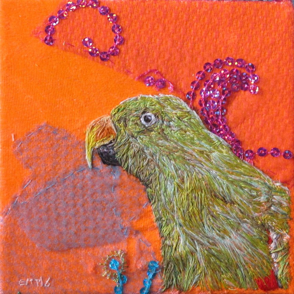 Hand embroidered Green Parrot on a neon orange background with hot pink sequins and turquoise netting 
