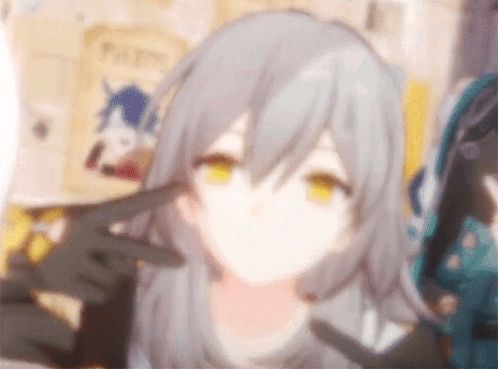 a blurry picture of a girl with gray hair and yellow eyes making a peace sign with her hands .