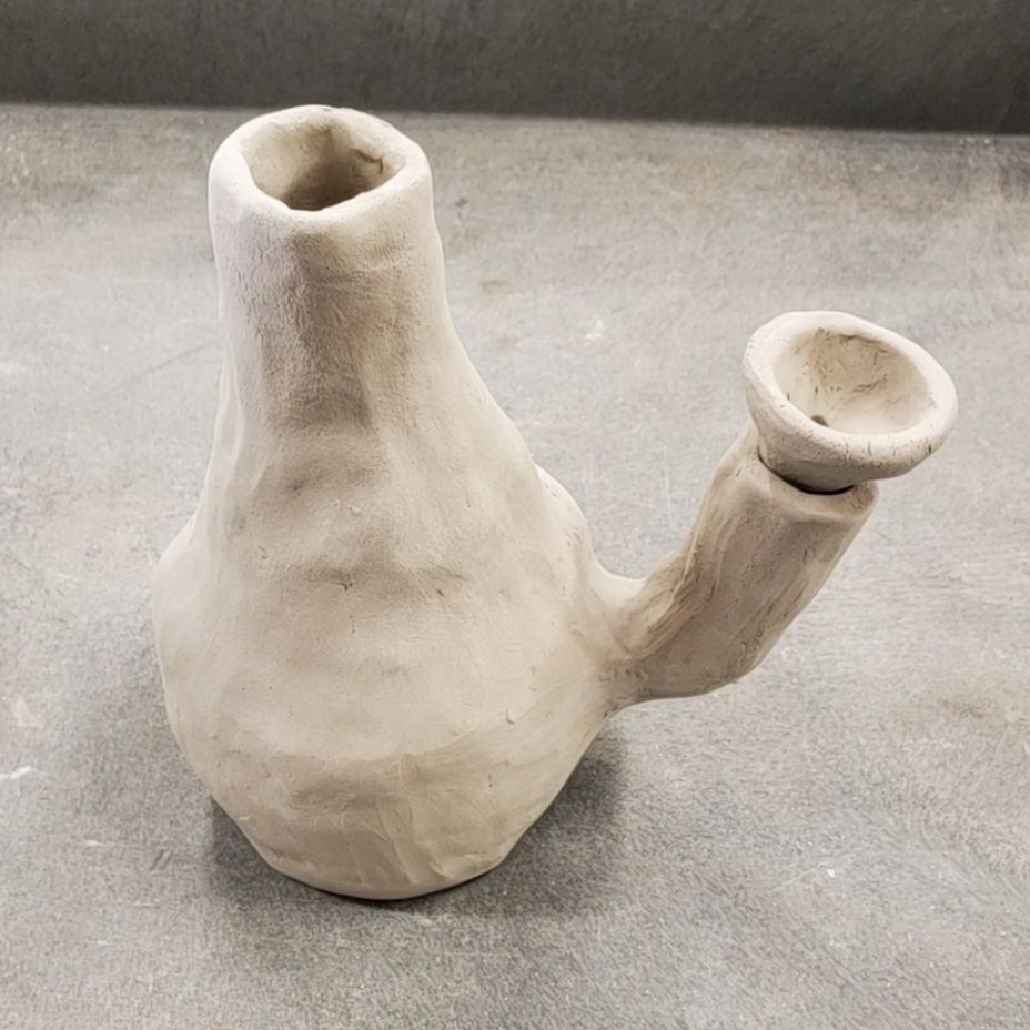The "vase" that a teenage boy wanted to get fired. It almost looks like a cactus with the separate arm and a little removable bowl on the arm but it is definitely a bong 😂
