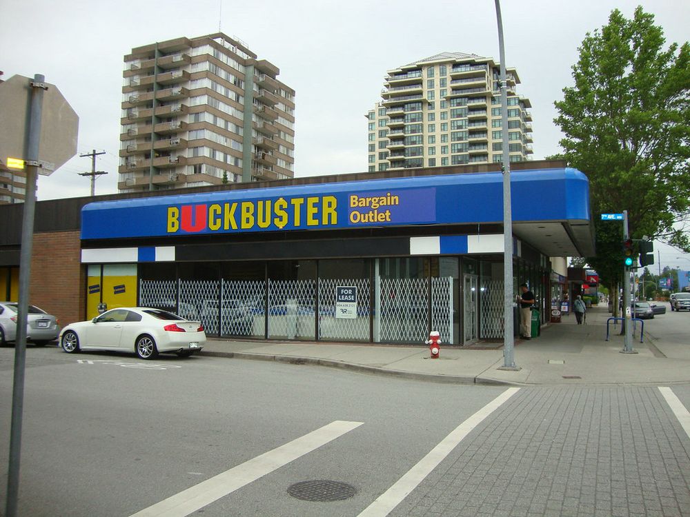 Blockbuster video sign repurposed as “Buckbuster” dollar store