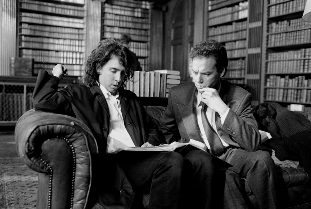 Behind The Scenes Photo from Batman (1989), with Director Tim Burton and Michael Keaton on the set for the Wayne Manor Library.