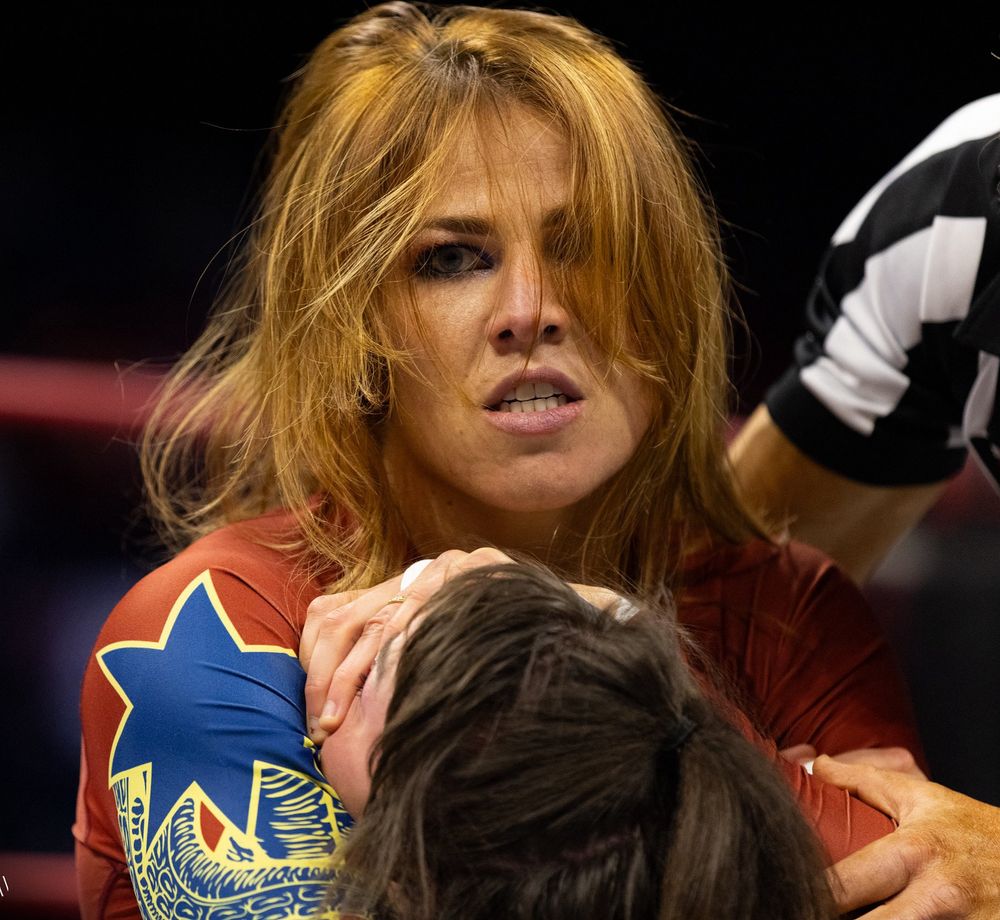 Marina Shafir headlocking someone 
