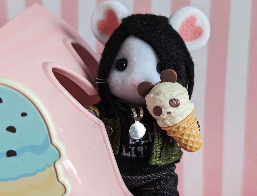 fun ghoul is poking out of a window of the ice cream car.