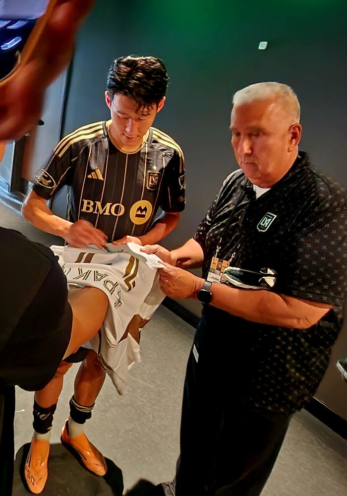 Son Heung-min, autographing a jersey, with Paul (LAFC team security).
