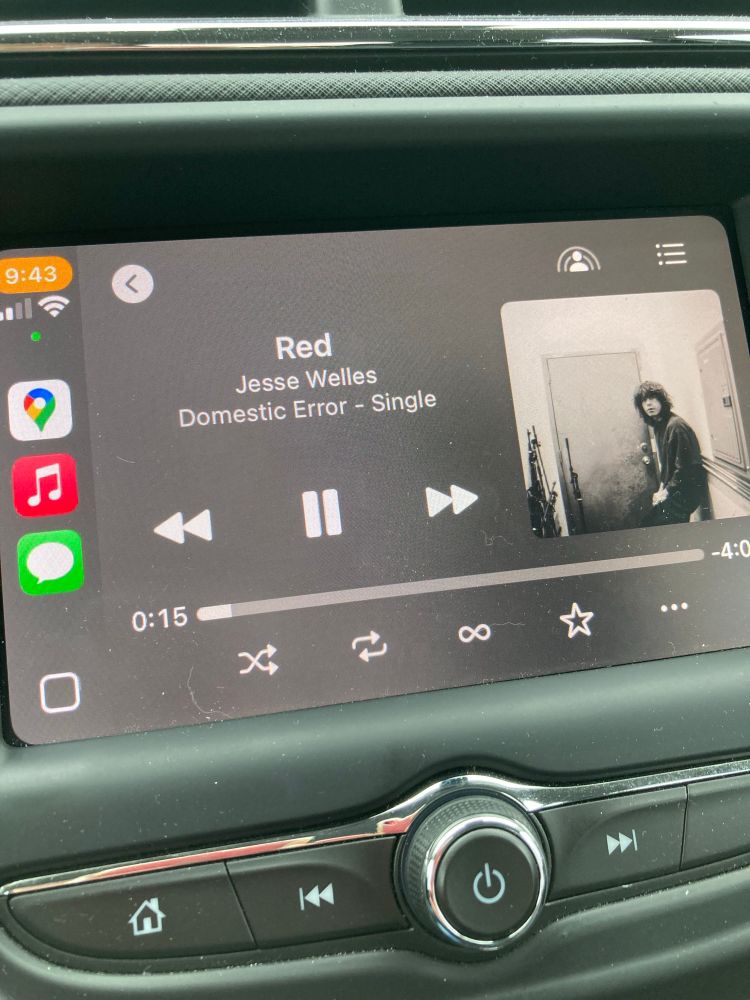 My car stereo playing Red by Jesse Welles 