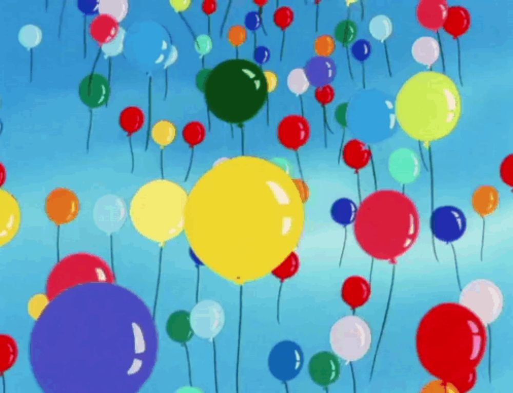 a bunch of colorful balloons floating in the sky