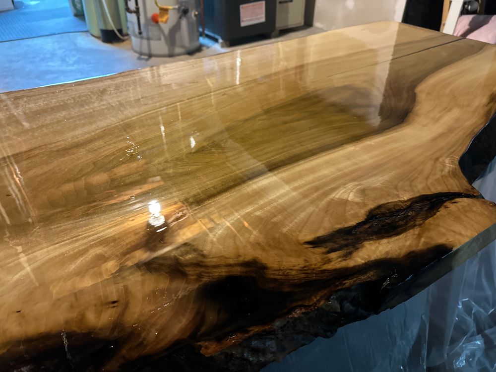 A nice piece of wood from a tulip tree that has a coat of poly on it in its process to being a wedding present