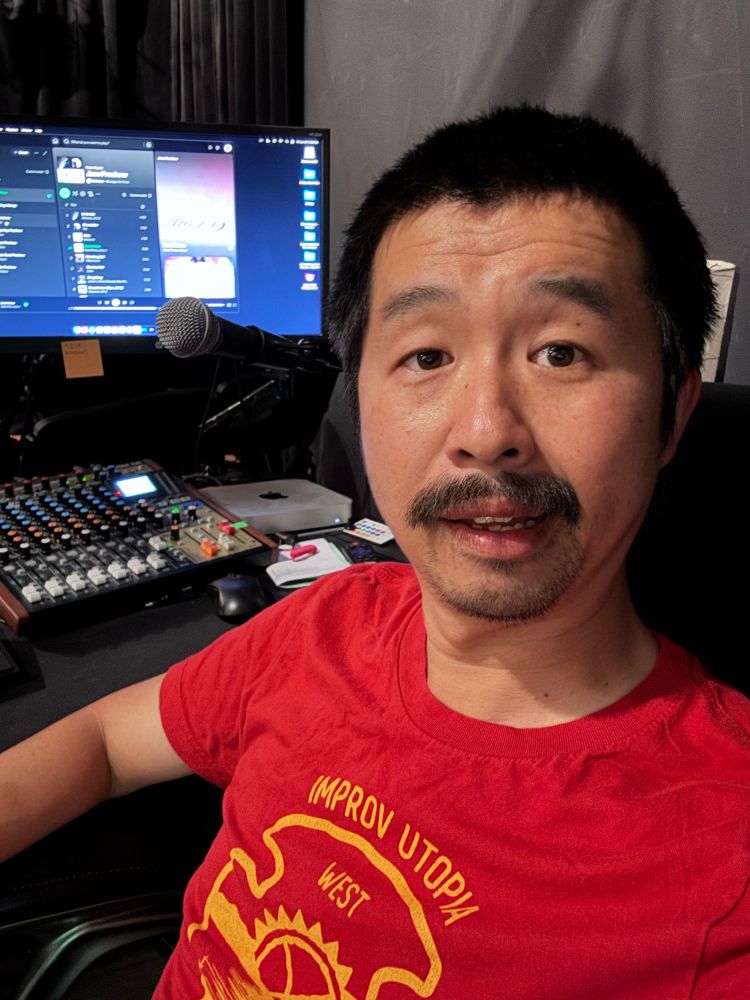 Selfie of me in the tech booth of the theater