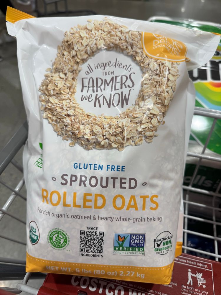 A 5lb bag of oats sitting in a Costco cart. 
