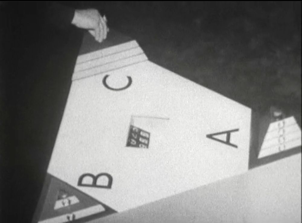 The Toymaker's trilogic game - a triangular, ten-counter version of the Tower of Hanoi game - being played by the Doctor, in TV's Dr Who and the Celestial Toymaker.