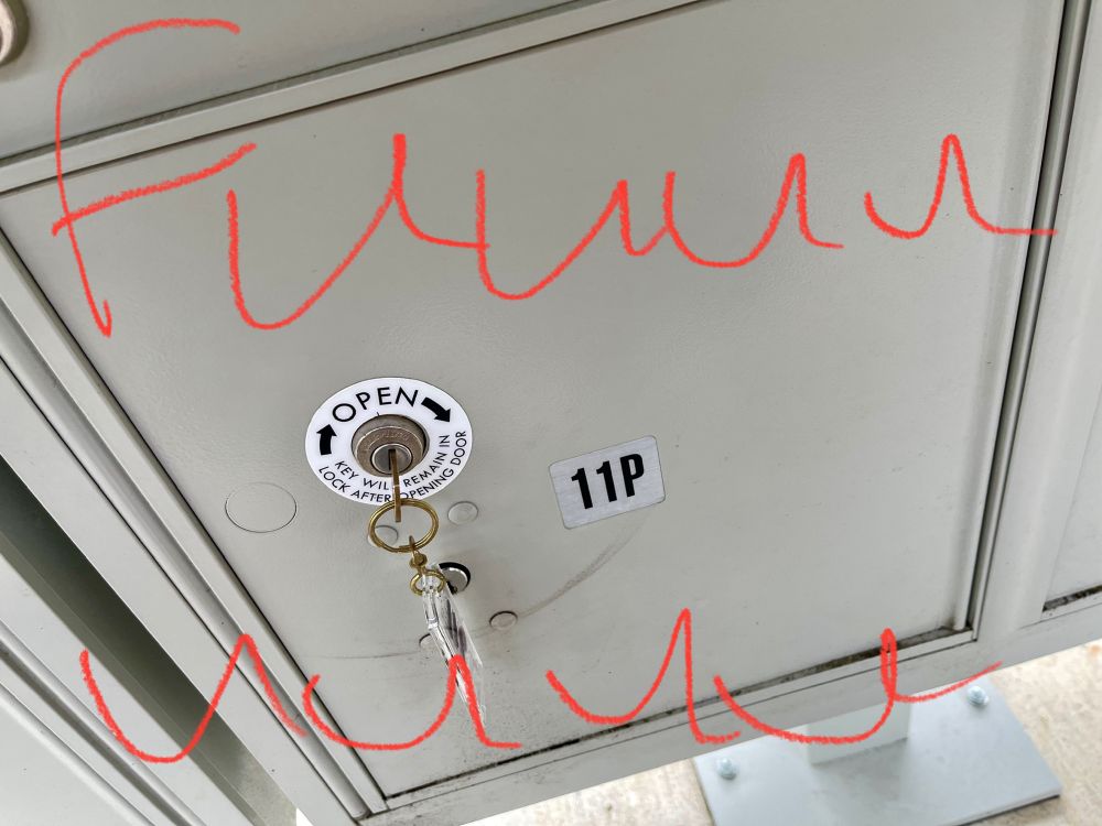 Photo of a parcel locker from a set of locked mailboxes. The key is in the correct parcel locker, but is stuck and will not open. Red text over the image reads, “Fuuuuuuuuu.” (Implying a long, drawn out “fuck”.)