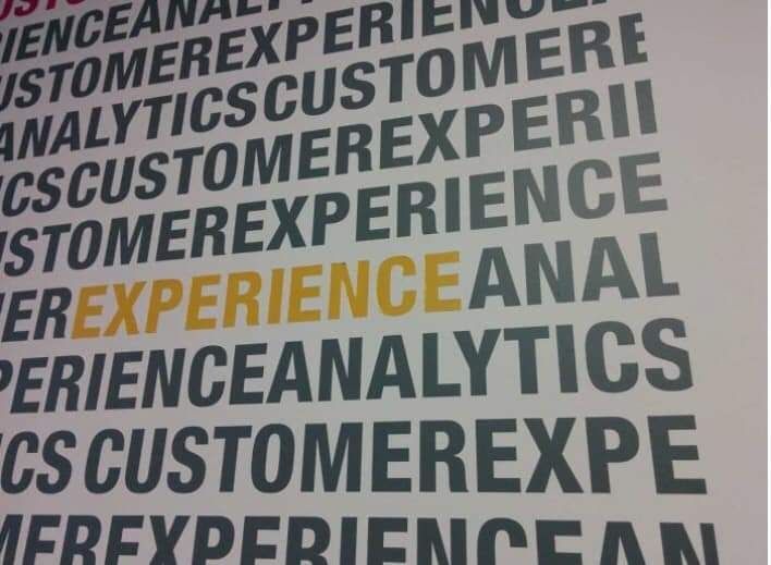Lines of text with frequent use of the word "experience". A single highlighted instance of the word "experience" is immediately followed by the word "analytics", but the text is cut off after the "L" so that the stand-out phrase caused by the highlighting reads as "experience anal".