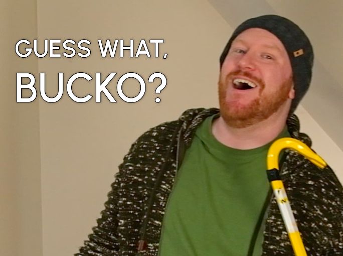 A still from todays upcoming episode of Stuff Keeps Happening. The camera is zoomed in on endeavorance who is off to the right, with text to the left reading, "GUESS WHAT, BUCKO?"