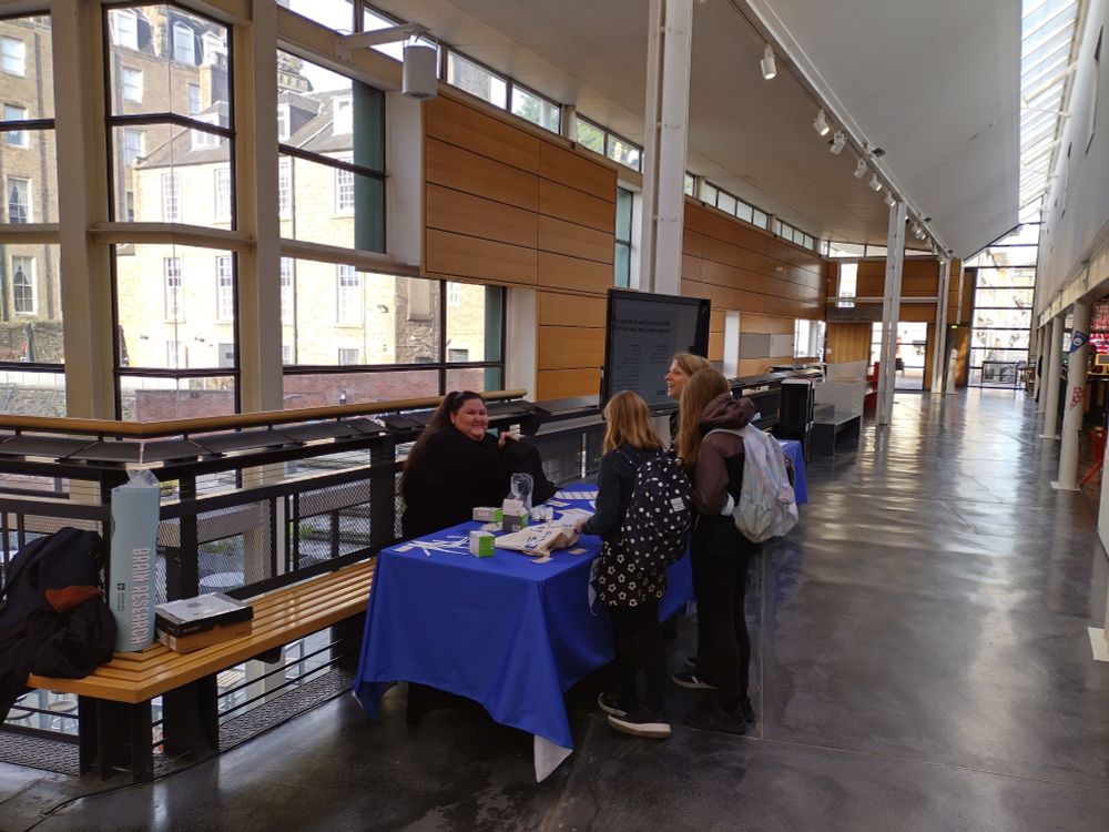 Cutting EEG reception desk at the DCA. Tanja Atanasova at the helm, Anne Keitel "signing up" our youngest attendees.