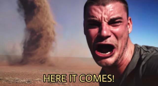 There’s a guy who’s clearly in distress as a tornado is forming behind him. “HERE IT COMES” could be seen in big, bold subtitles 