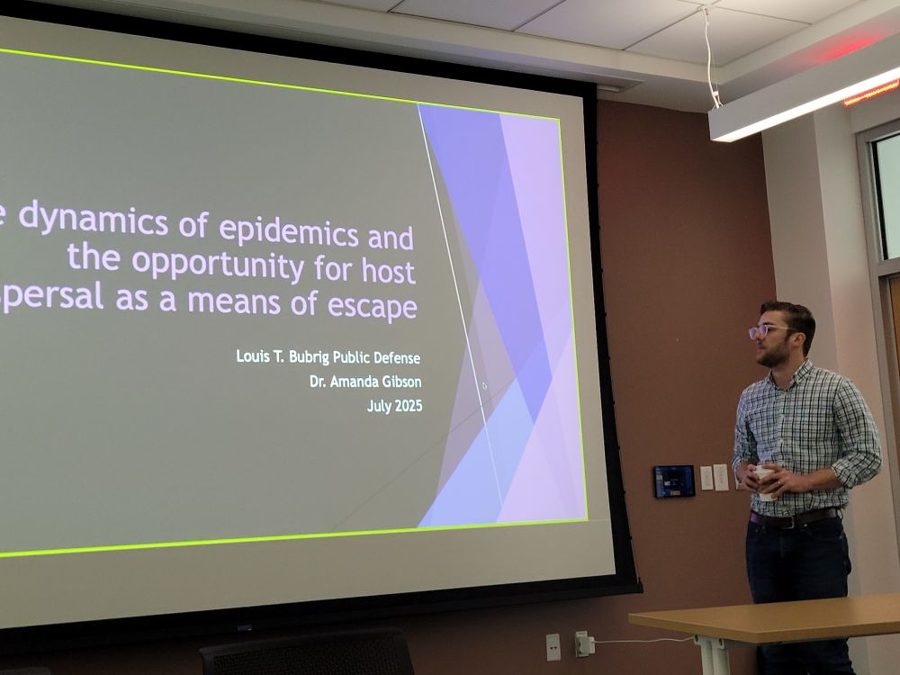 Dr. Louis Bubrig defending his dissertation